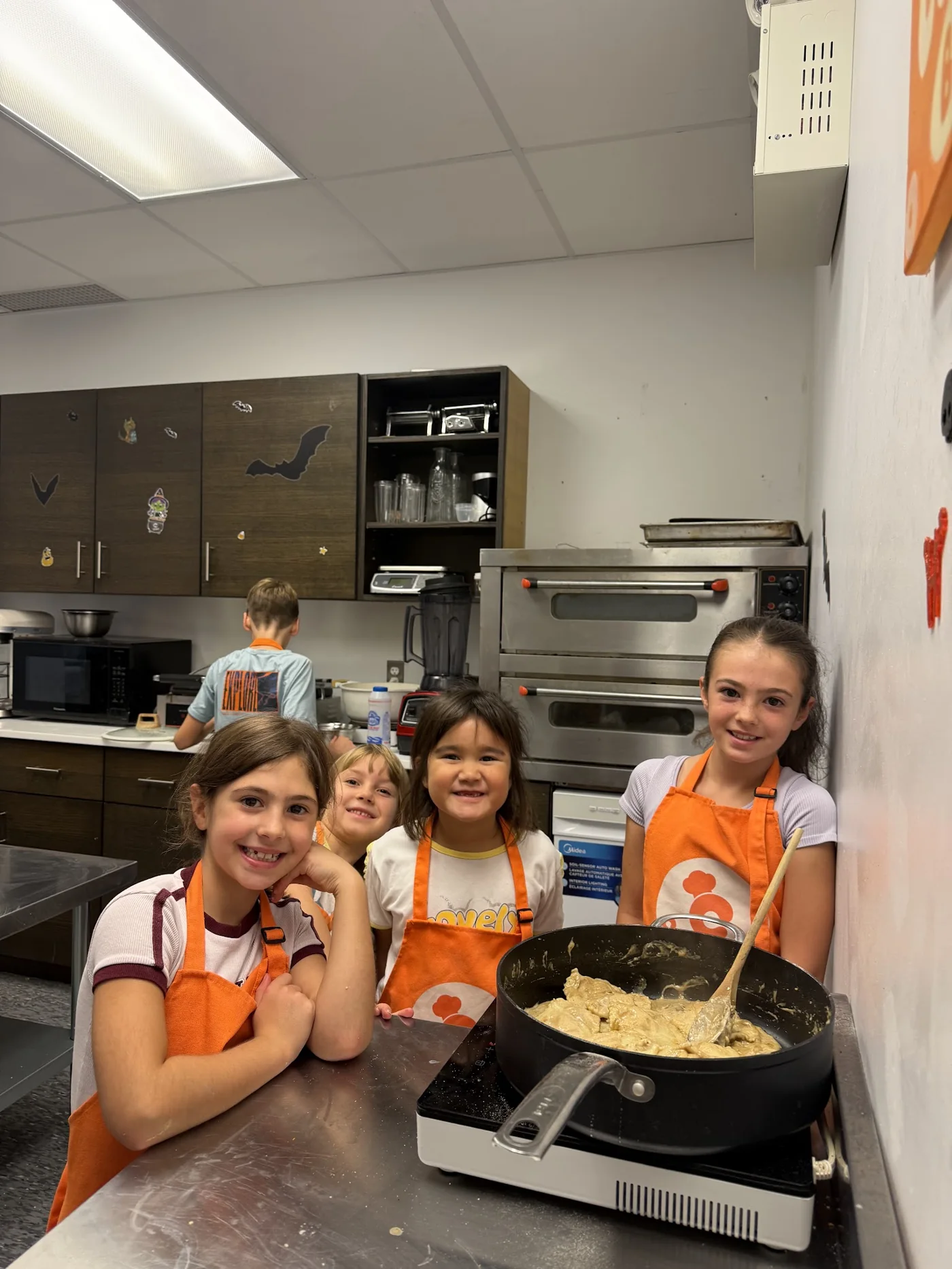 Children learning to cook at a Cookiddoo after-school program in Ottawa