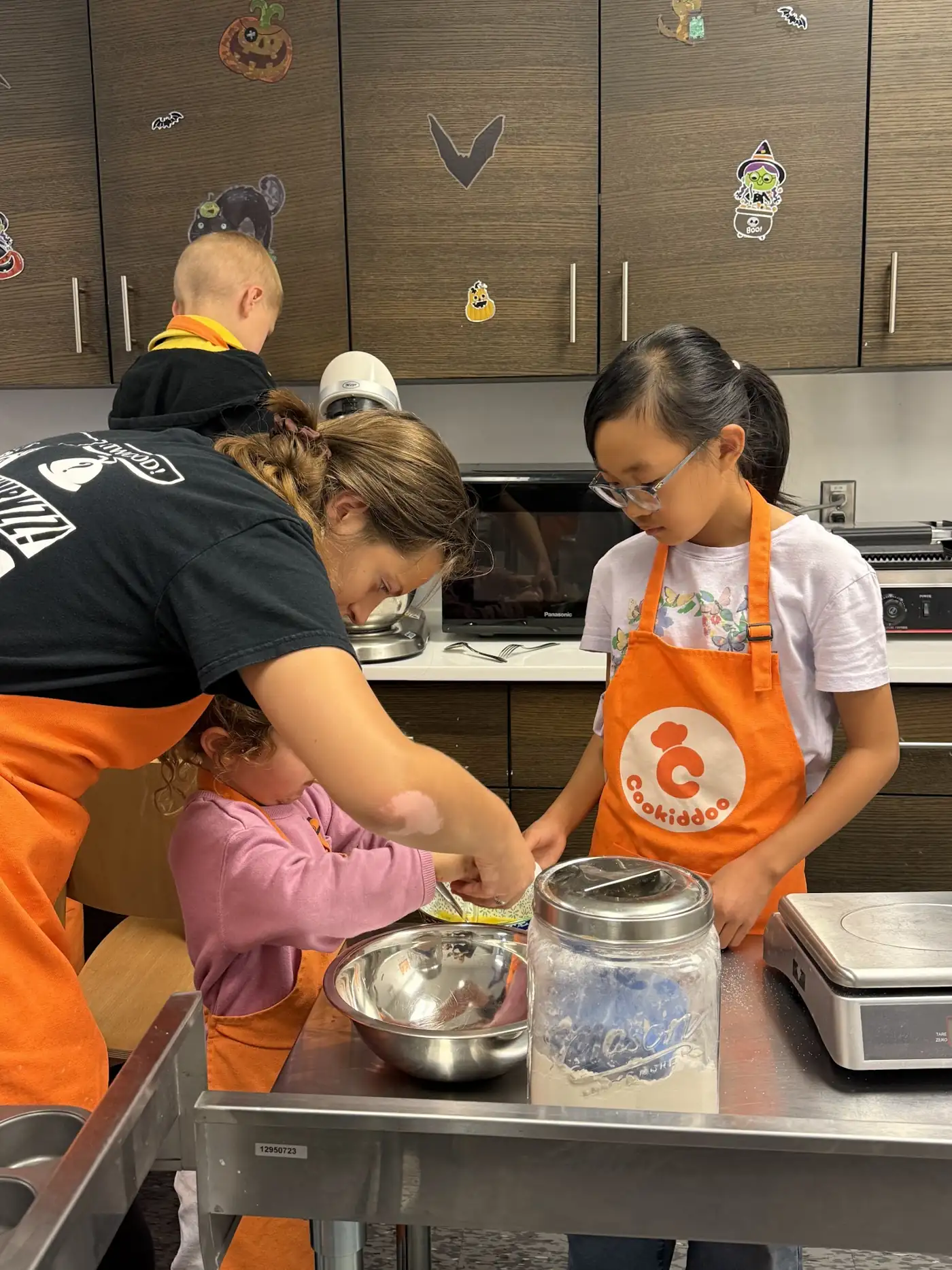 Cookiddoo instructor teaching a child to cook in Kanata, Ottawa