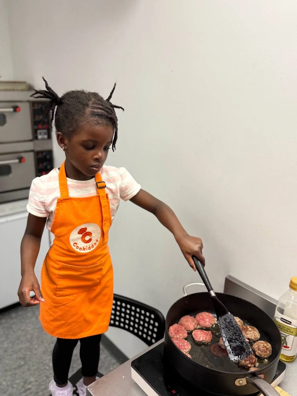 Young chef learning to cook at a Cookiddoo class in Kanata, Ottawa